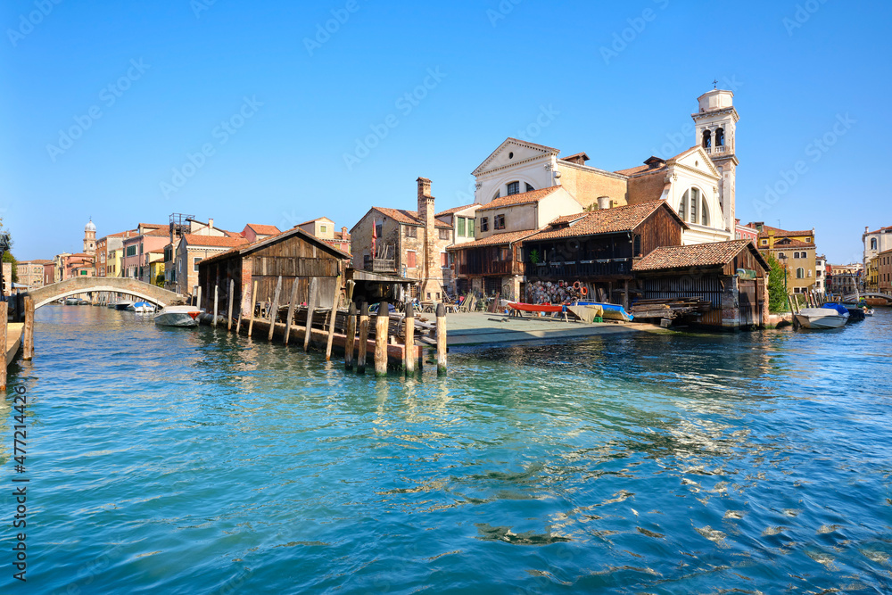 Romantic Venice, Squero di San Trovaso, famous boatyard in Venice. Landmark boat yard for building and repair of traditional wooden gondolas. Romantic Venice, Squero di San Trovaso, famous boatyard in Venice. Landmark boat yard for building and repair of traditional wooden gondolas.
