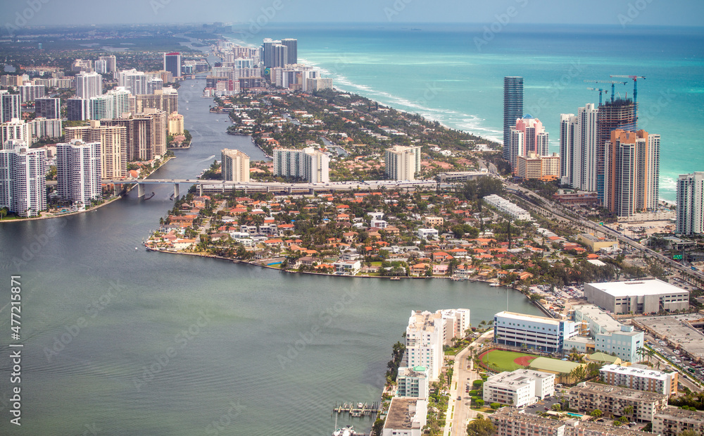Aerial view of Miami Beach buildings and canals on a cloudy day, Florida.