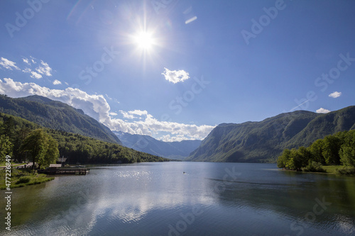 Panorama of Lake Bohinj  also called bohinjsko jezero  on a sunny afternoon. Bohinj lake is a major landmark of the Julian Alps mountain chain in Slovenia  Europe......