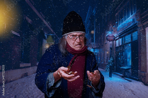 Scrooge holding gold coins, walking in street under the snow on a Christmas Eve photo