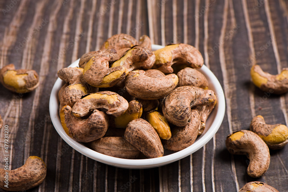 Fototapeta premium cashew nuts on wooden background