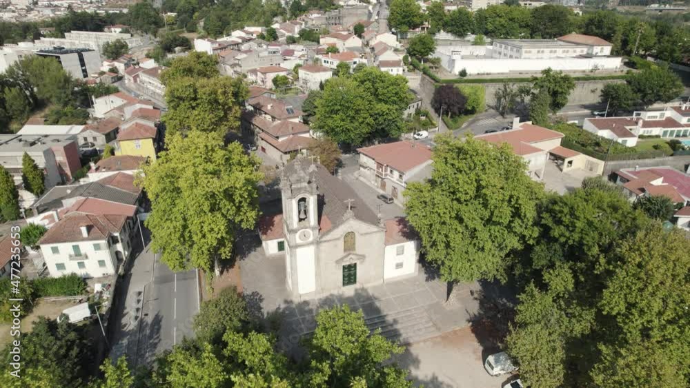 Drone flight over tree lane reveals Church of St. Damasus; Guimaraes Drone flight over tree lane reveals Church of St. Damasus; Guimaraes
