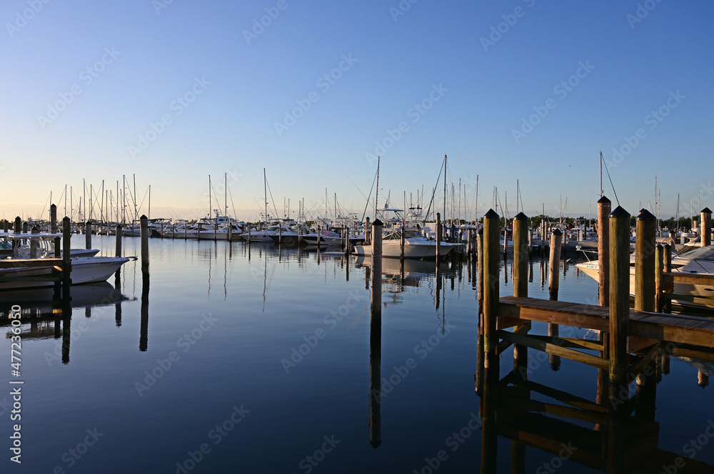 Boats and docks of Dinner Key Marina in Coconut Grove, Miami, Florida at first light.