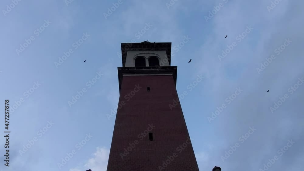 panning shot of a creepy tall tower with vultures flying n the sky at Stephen foster culture center in Florida in 1080p 30p panning shot of a creepy tall tower with vultures flying n the sky at Stephen foster culture center in Florida in 1080p 30p