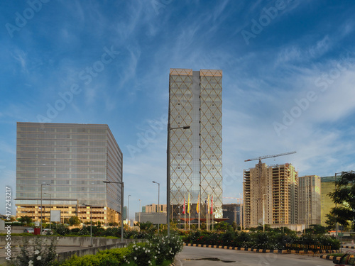 High tech modern buildings and some under construction on a clear day in India Asia