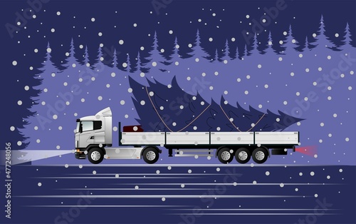 Very peri. Color of the year. A modern European truck with a semi-trailer is carrying a Christmas tree for the holiday at night from the forest in the snow.