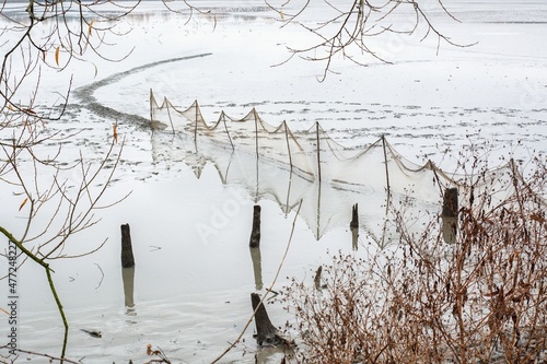Outstretched nets and quay when catching a pond. Bartosovice. Northeast Moravia. Europe.  photo