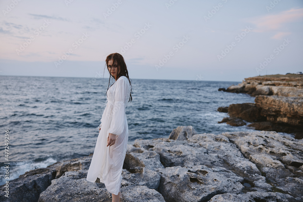 Attractive woman enjoying for view of the beautiful sea on her holiday nature Attractive woman enjoying for view of the beautiful sea on her holiday nature