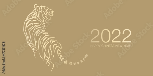 Happy Chinese New Year 2022 by gold brush stroke abstract paint of the tiger isolated on golden background