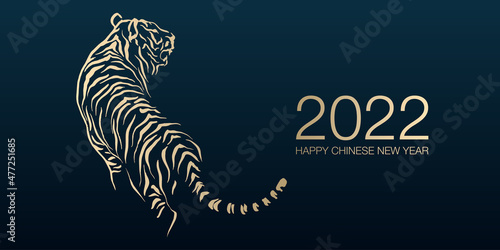 Foto Happy Chinese New Year 2022 by gold brush stroke abstract paint of the tiger isolated on dark blue background