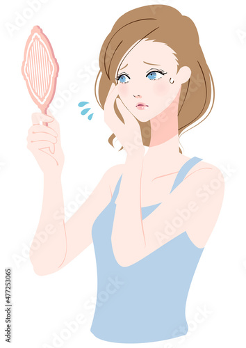 鏡を見る女性