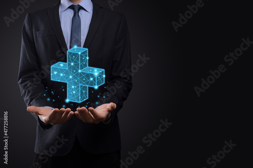 Businessman hand holding 3D plus low polygonal icon.Plus sign virtual means to offer positive thing like benefits, personal development, social network Profit,health insurance, growth concepts.