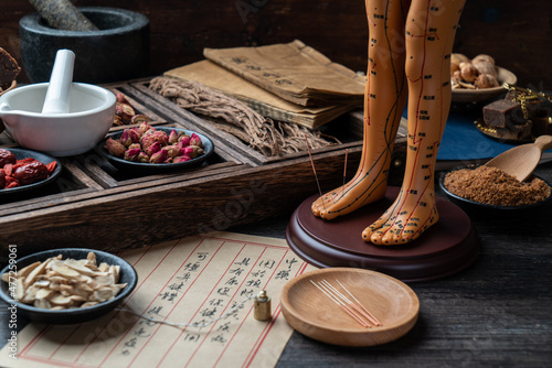 Canvas Print Acupuncture puppets and traditional Chinese medicine are on the table