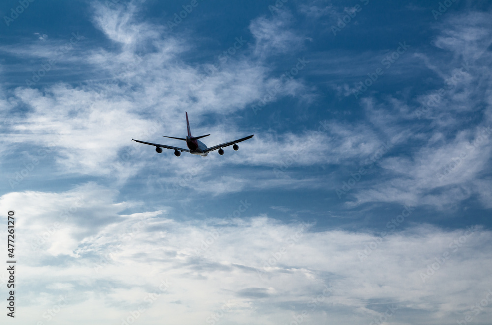 Silhouette of an airplane flying isolated on cloudy sky day background. Silhouette of an airplane flying isolated on cloudy sky day background.