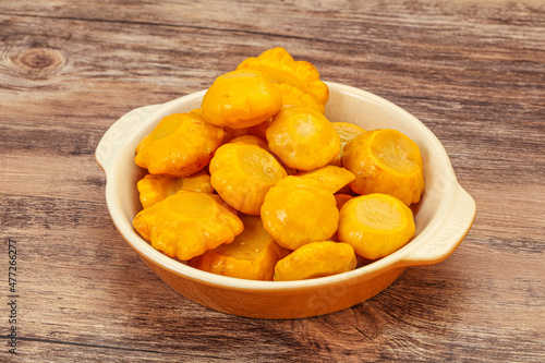 Marinated yellow patisson in the bowl