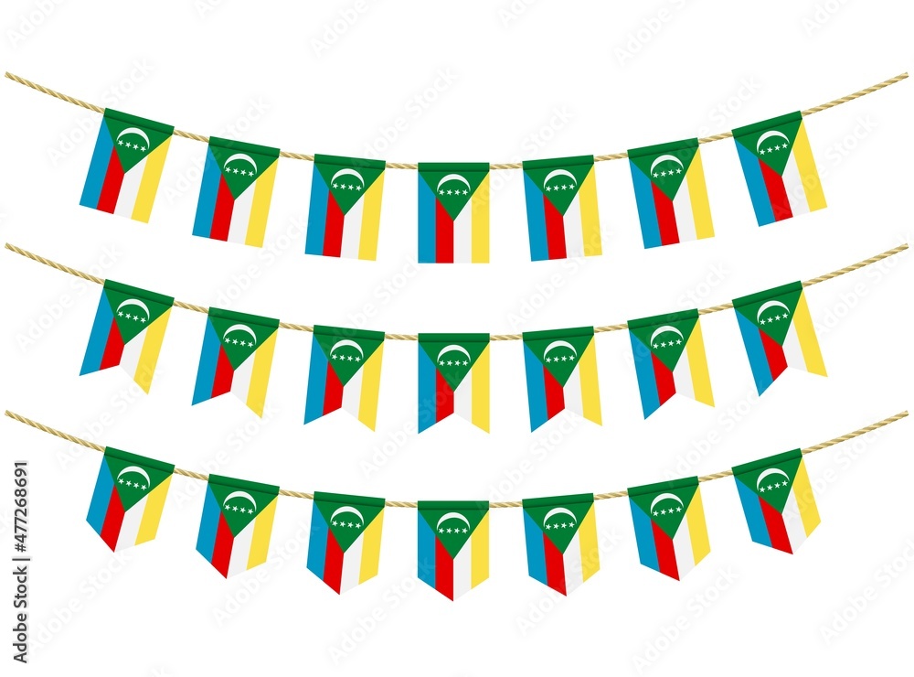 Obraz premium Comoros flag on the ropes on white background. Set of Patriotic bunting flags. Bunting decoration of Comoros flag