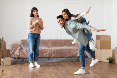 Happy muslim family having fun on moving day