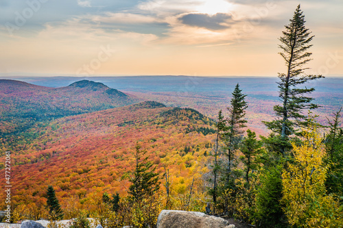 View on the mountains and the fall foliage of Mont Megantic National park from a belvedere along the "Sentier des Cimes" hiking trail, in Eastern Townships, Quebec, Canada