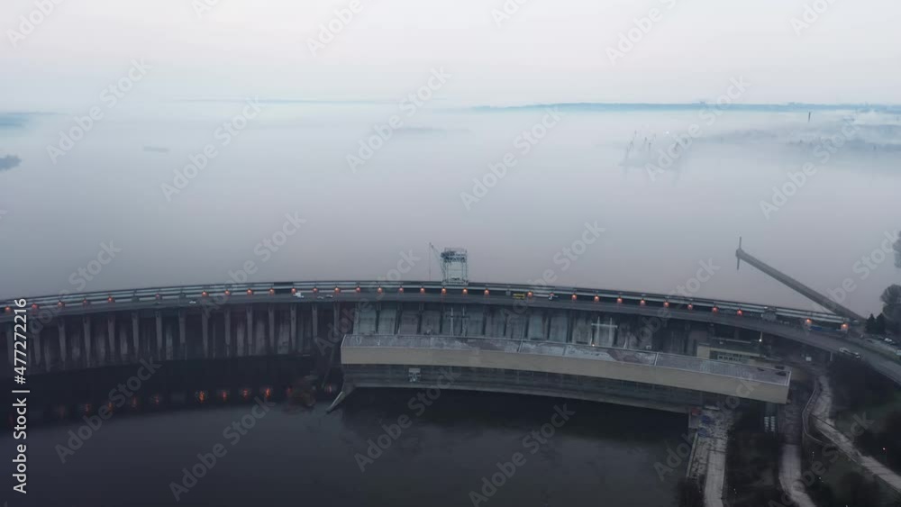 Zaporozhye, Ukraine Hydroelectric water-power plant, city traffic, cars top view flight with drone 4K. Bad ecology Zaporozhye, Ukraine Hydroelectric water-power plant, city traffic, cars top view flight with drone 4K. Bad ecology