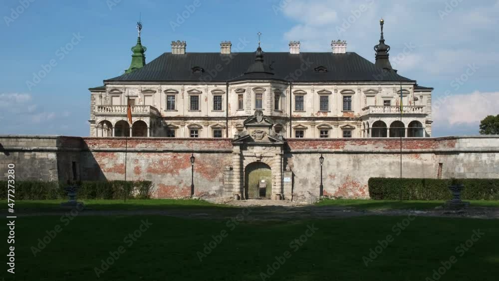 Historical estate in a green forest. Drone aerial view of a fabulous castle Historical estate in a green forest. Drone aerial view of a fabulous castle