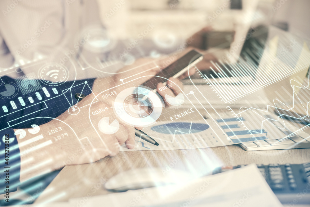 Double exposure of man's hands holding and using a digital device and tech theme hologram drawing. Technology concept. Double exposure of man's hands holding and using a digital device and tech theme hologram drawing. Technology concept.