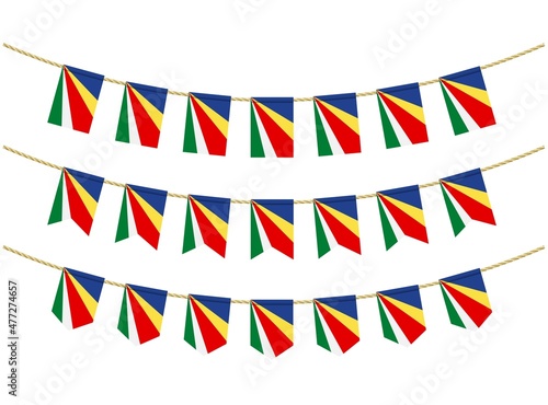 Seychelles flag on the ropes on white background. Set of Patriotic bunting flags. Bunting decoration of Seychelles flag