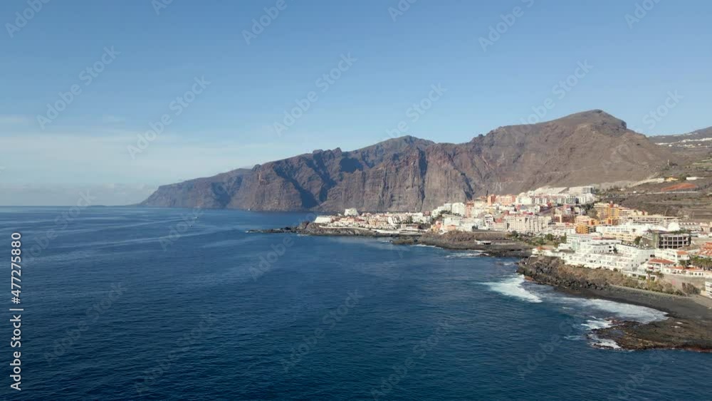 Aerial view of the Los Gigantes cliffs and Puerto Santiago on the island of Tenerife, Canary Islands, Spain. Aerial view of the Los Gigantes cliffs and Puerto Santiago on the island of Tenerife, Canary Islands, Spain.