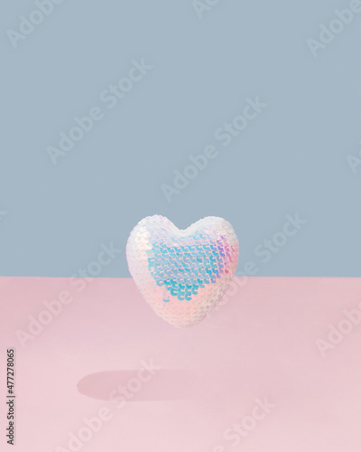 disco heart flying.love concept design.aesthetic heart design on a soft pink and sky blue background.valentine holidays idea.happy festive celebration