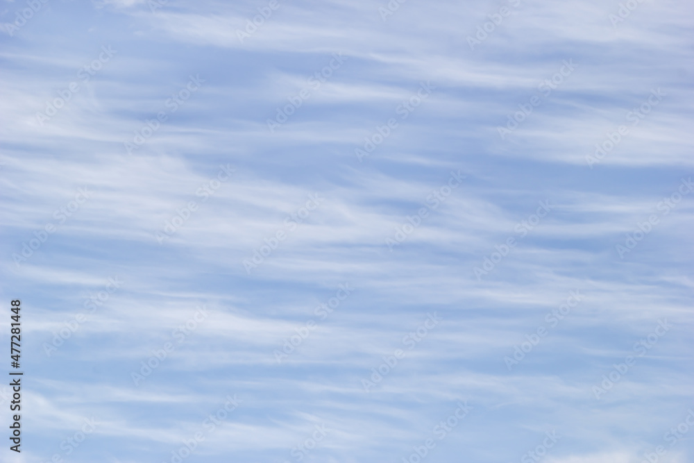Texture white cirrus clouds on the background blue sky. Texture white cirrus clouds on the background blue sky.