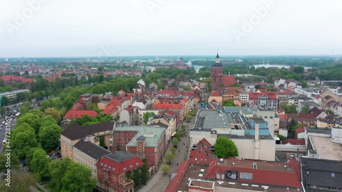 Wallpaper Mural Tight fly around top of lookout tower with clock. Revealing aerial view of old town with wide pedestrian zone and old church. Berlin, Germany Torontodigital.ca
