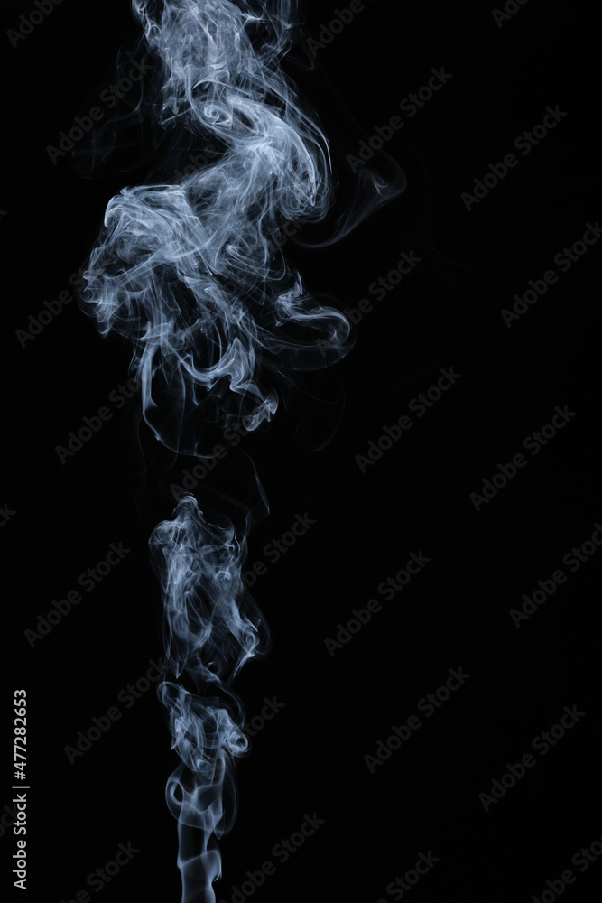 Clouds of curls of smoke on a black background. Clouds of curls of smoke on a black background.