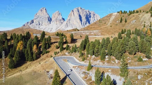 Slow moving HD aerial flight over Passo Sella or Sellajoch in the Dolomites in Italy photo