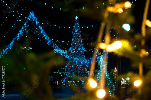 Colorful lights in Burgas city centre.Lights and decorations for Christmas.Translation on the signs are: Happy Holidays. photo