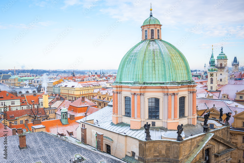 Panorama of Prague roofs covered with snow in winter, Czech Republic