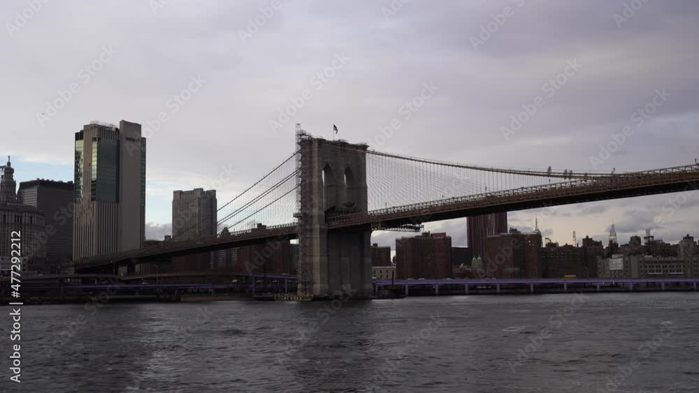 Iconic Brooklyn bridge with majestic city skyline in New York, handheld shot Iconic Brooklyn bridge with majestic city skyline in New York, handheld shot