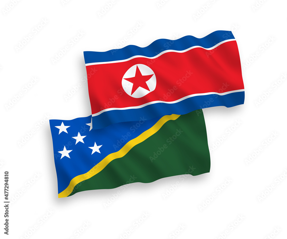 National vector fabric wave flags of North Korea and Solomon Islands isolated on white background. 1 to 2 proportion.