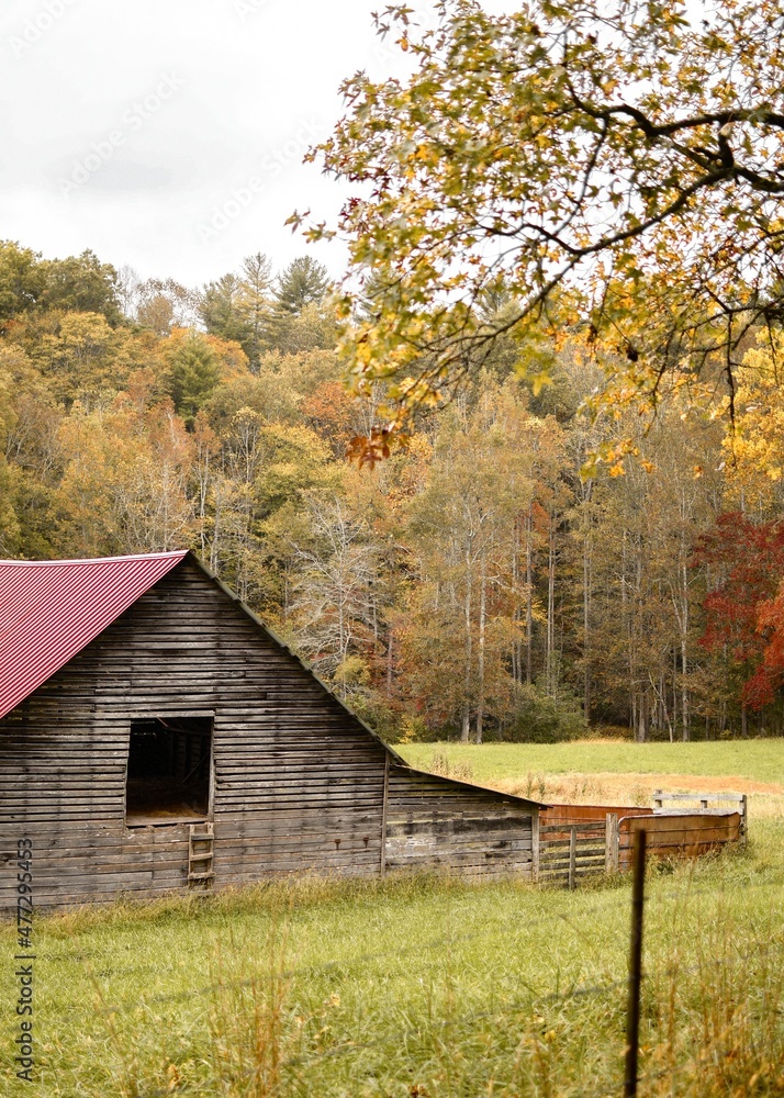 Old red barn in the autumn mountain countryside Old red barn in the autumn mountain countryside