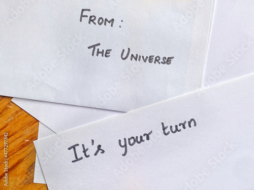 Text on letter fronts - From The Universe and It's Your Turn - Voice from the Universe, motivational message concept