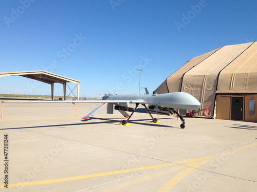 A generic-looking military MQ-1 predator unmanned aerial vehicle drone (all decals removed) with two dummy hellfire missiles.