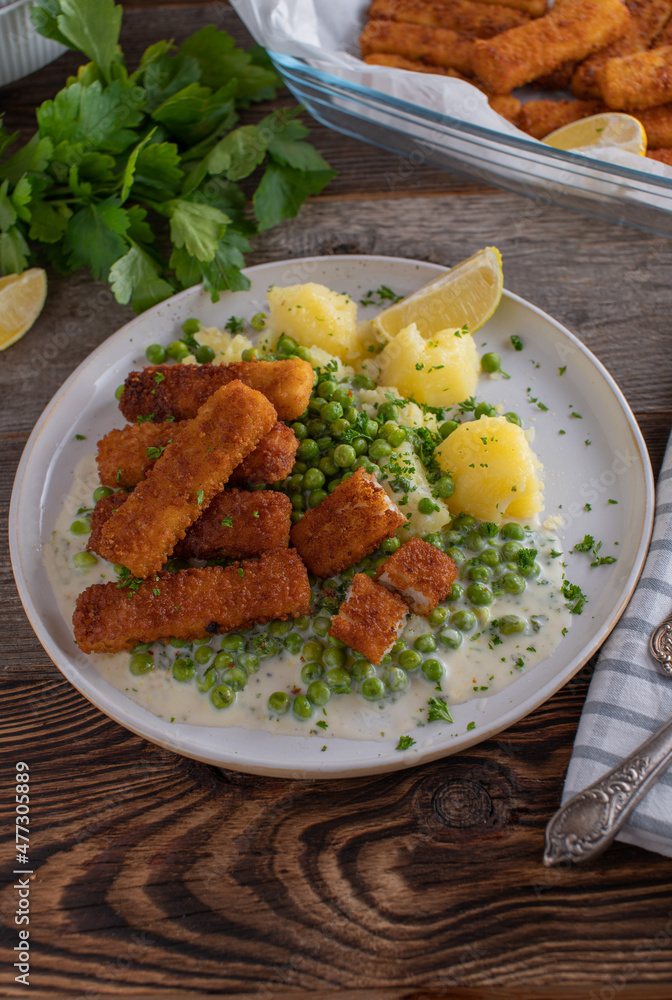 Fish sticks with vegetables, potatoes and sauce Fish sticks with vegetables, potatoes and sauce