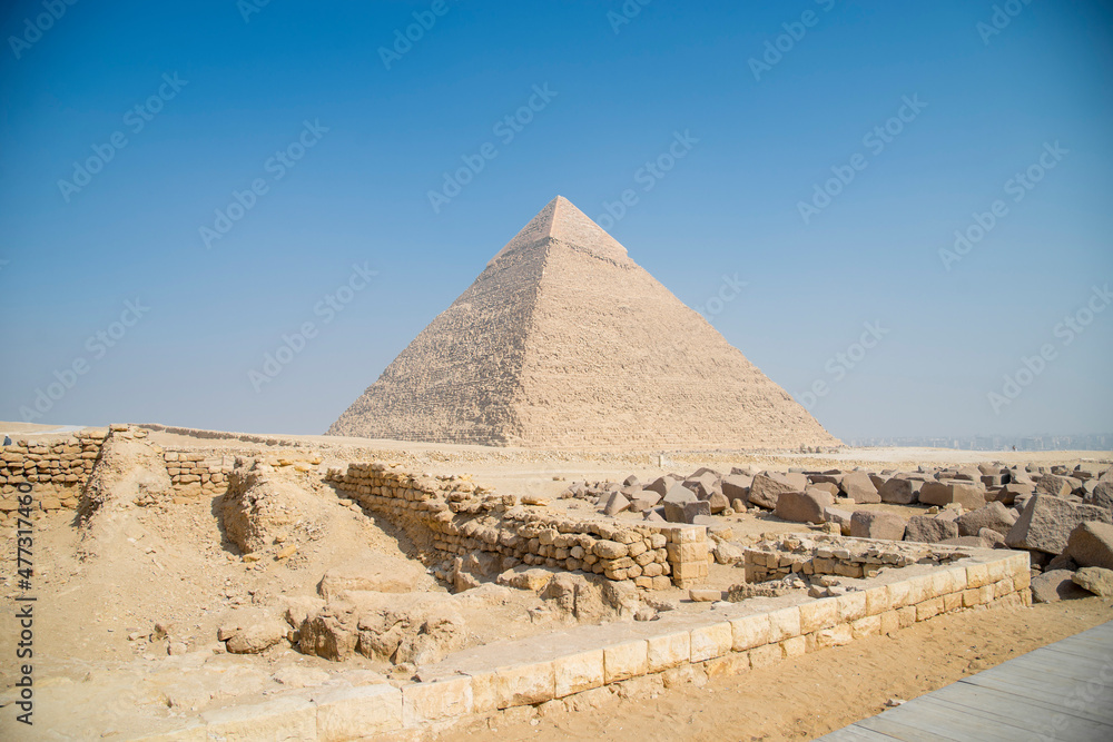 Landscape of the pyramids in the desert with blue sky in Giza, Egypt Landscape of the pyramids in the desert with blue sky in Giza, Egypt