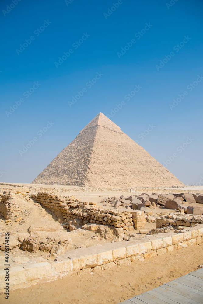 Landscape of the pyramids in the desert with blue sky in Giza, Egypt Landscape of the pyramids in the desert with blue sky in Giza, Egypt