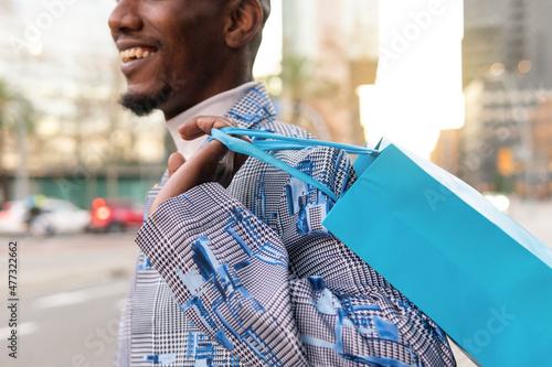 Unrecognizable man with shopping bags photo