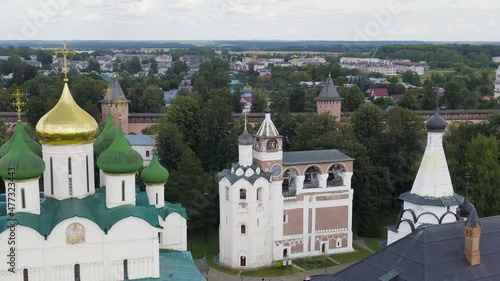 Dolly zoom. Suzdal, Russia. Flight. The Saviour Monastery of St. Euthymius. Cathedral of the Transfiguration of the Lord in the Spaso-Evfimiev Monastery. Belfry, Aerial View, Departure of the camera photo