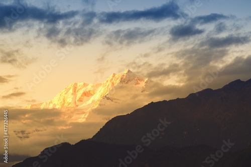 Beautiful last light from sunset on Mount Kanchenjugha, Himalayan mountain range, Sikkim, India. color tint on the mountains at dusk