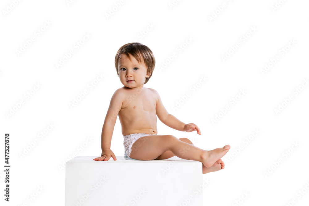 Cute little boy, baby, child in diaper isolated over white studio background. Childhood concept Cute little boy, baby, child in diaper isolated over white studio background. Childhood concept