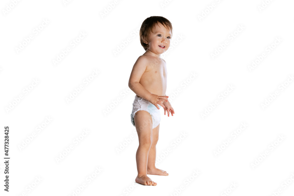 Portrait of little boy, baby, child in diaper isolated over white studio background. Childhood concept Portrait of little boy, baby, child in diaper isolated over white studio background. Childhood concept