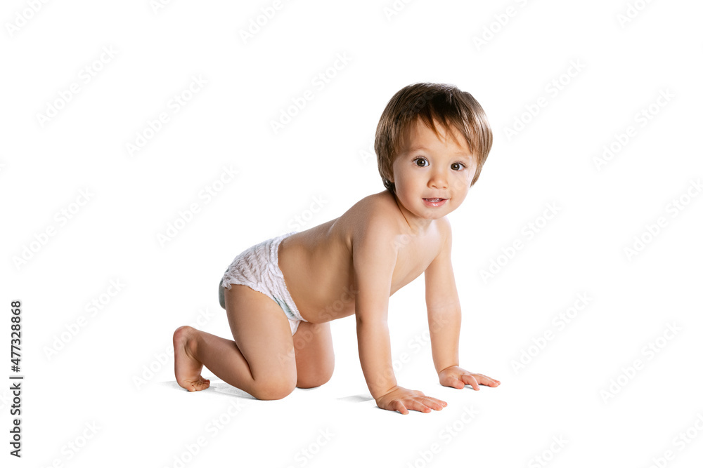 Portrait of little boy, baby, child in diaper isolated over white studio background. Childhood concept Portrait of little boy, baby, child in diaper isolated over white studio background. Childhood concept