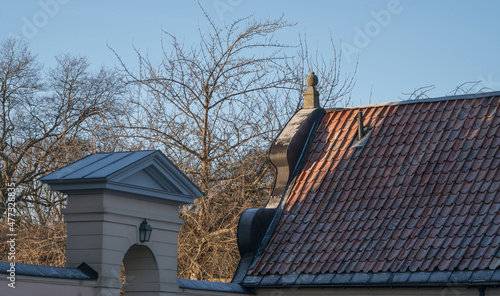 Roofs of old profane castle building from 1650s, Hässelby slott a sunny frosty winter day in Stockholm photo