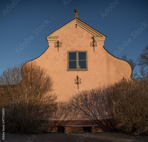 Facade of an old profane castle building from 1650s, Hässelby slott in its park a sunny frosty winter day in Stockholm